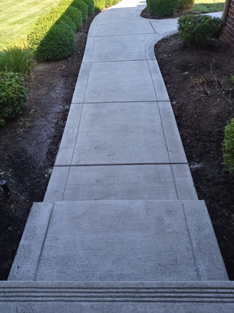 concrete residential front entry sidewalk with steps