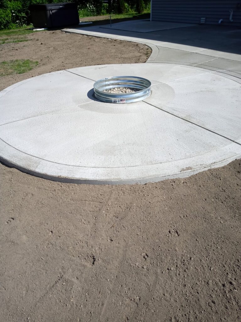 New concrete radius firepit patio - flatwork