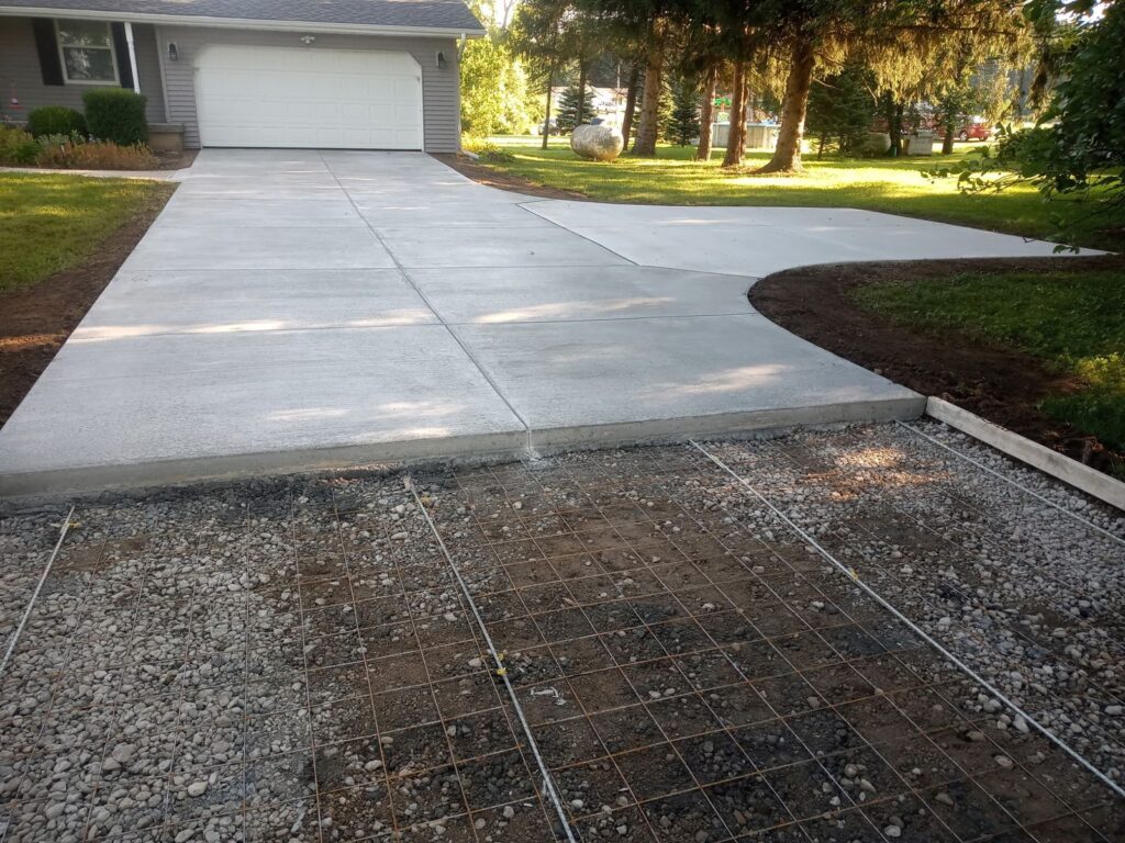 After of new concrete flatwork driveway